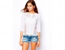 Top in pizzo con maniche a 3/4 e inserti trasparenti