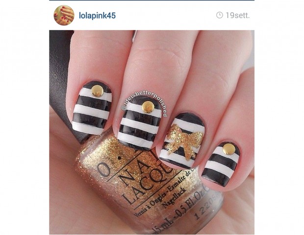 Fiocco oro sulla manicure a righe