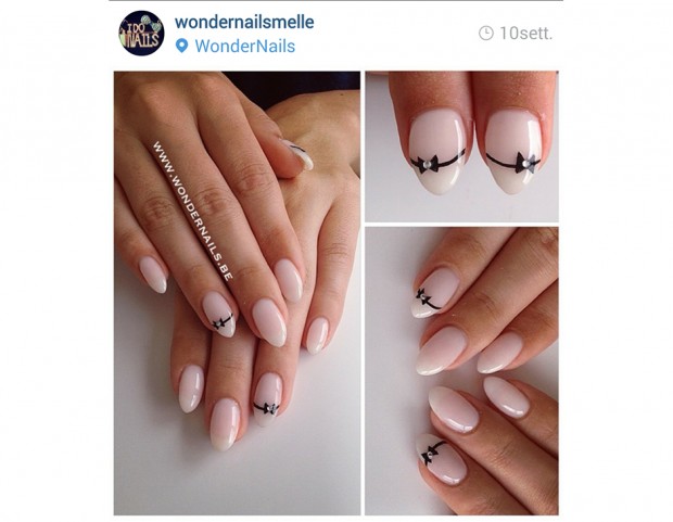 Manicure delicata con fiocchetti neri