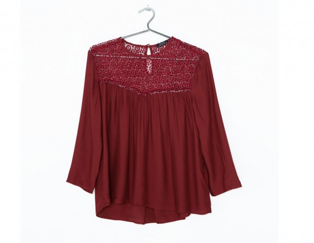 Blusa morbida con scollo decorato traforato