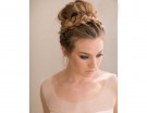 Chignon alto con trecce