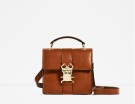 Borsa compatta con chiusura in metallo