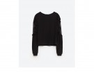 Blusa con volant e inserti in pizzo