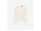 Blusa in pizzo con volant