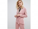 Blazer fluido con fiocco in vita