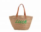 Borsa di paglia con scritta “Luck”